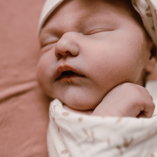Newborn on pink