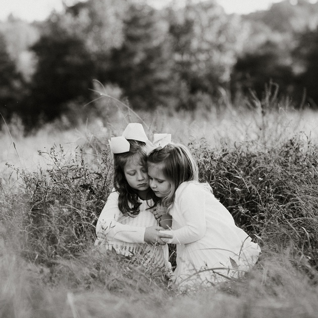 Little girls in tall wheat